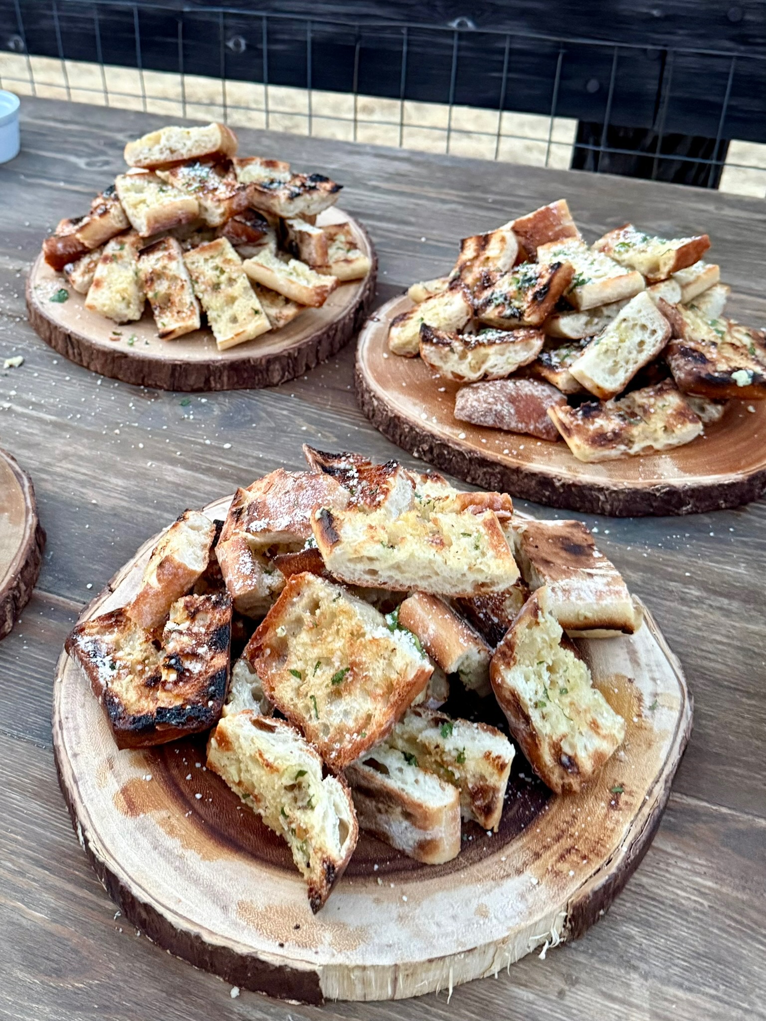 Grilled garlic bread on wood boards